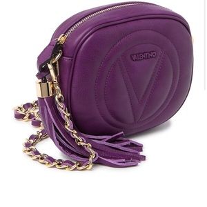 Used Valentino purple with gold tassel bag.